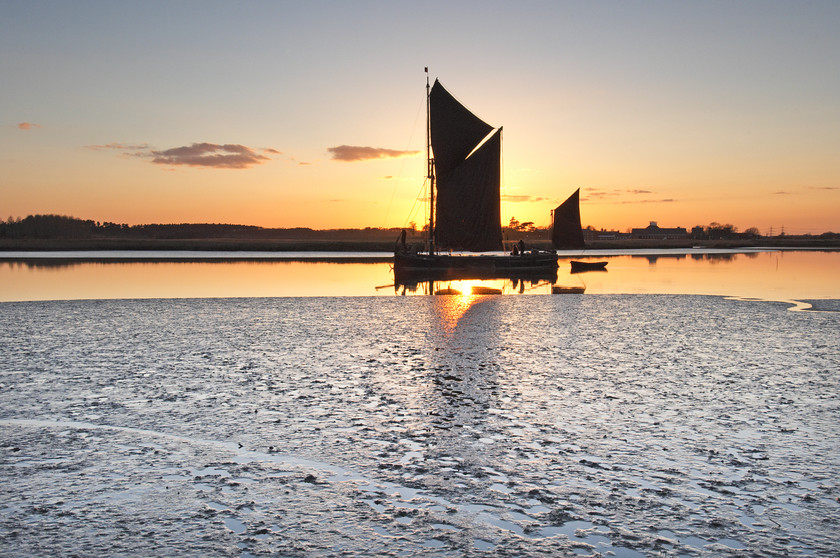 Sunset & thames barge on river alde in suffolk 
 thames barge on river alde in sunset with mudflats 
 Keywords: River Alde, Suffolk, Sunset, Tony Pick, estuary, mudflat, nautical, thames barge