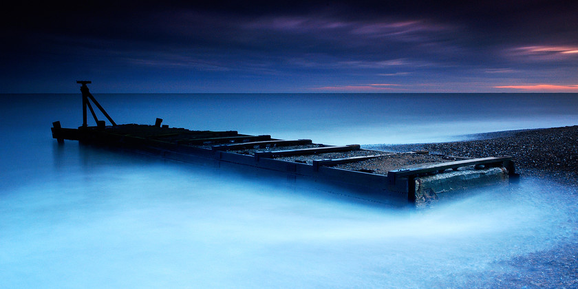 Atmospheric sluice structue in sea-1 
 Sluice structure in sea with mist 
 Keywords: Mist, Sea, Sluice, Suffolk, Tony Pick, atmospheric, blue, movement, nautical, sky, smoke, structure, tide, waves