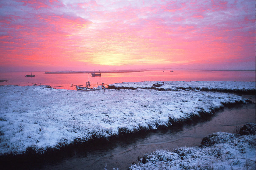 Sunset on river alde in suffolk in snow-1 
 Sunset over river alde in snow with boat 
 Keywords: River Alde, Snow, Suffolk, Sunset, Tony Pick, Winter, estuary, nautical