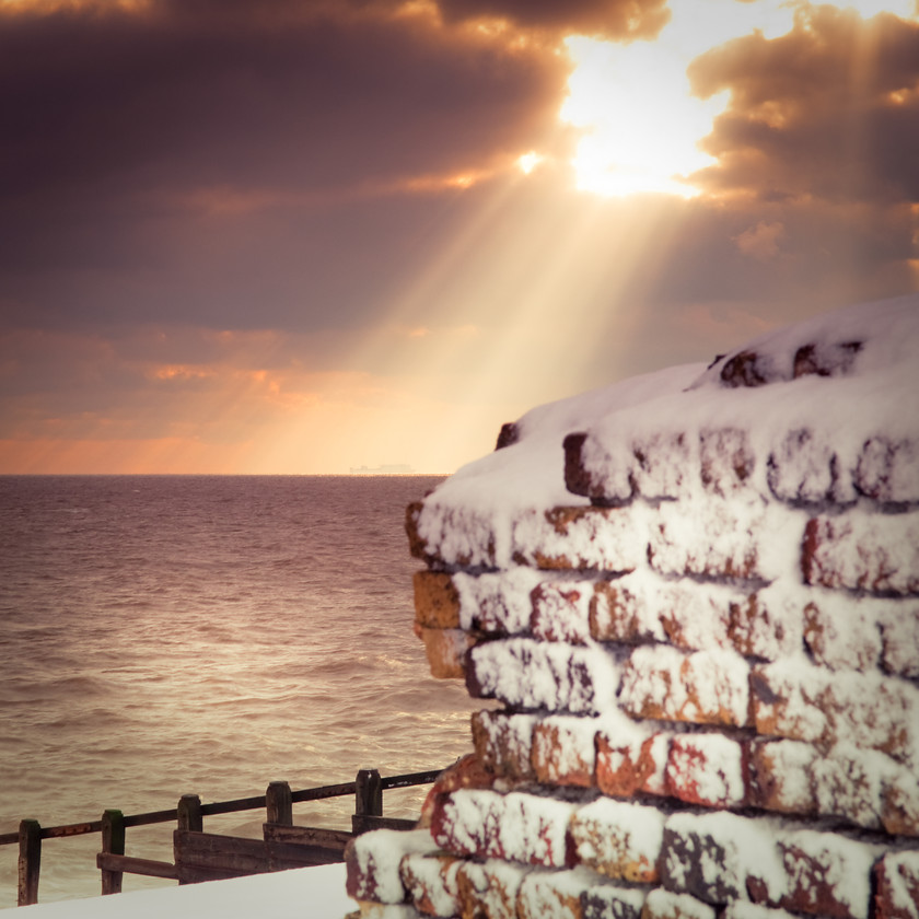 Ray of light through clouds on sea-1 
 starburst ray of light on sea and beach 
 Keywords: Aldeburgh, Beach, Clouds, Ray, Sea, Suffolk, Sun, Tony Pick, Wall, light, nautical, starburst, tide, waves